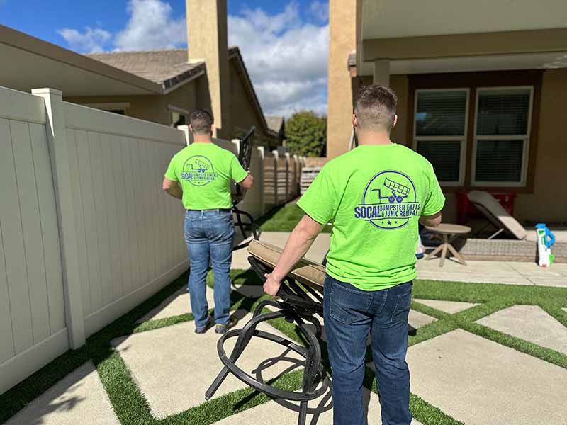 SoCal Dumpster Rentals and Junk Removal Experts Carrying Furniture